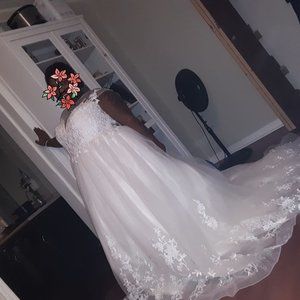 Never worn wedding dress for sale.